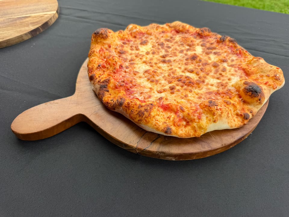 Golden freshly cooked pizza ready to share
