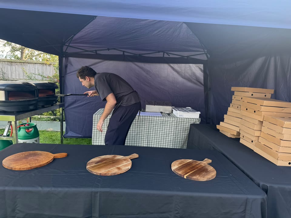 Xanders catering team preparing fresh pizza