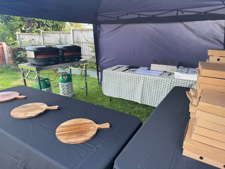 Xanders catering team preparing fresh pizza