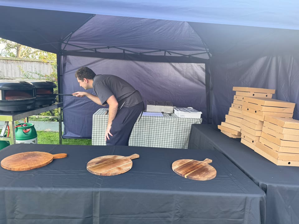 Xanders catering team preparing fresh pizza