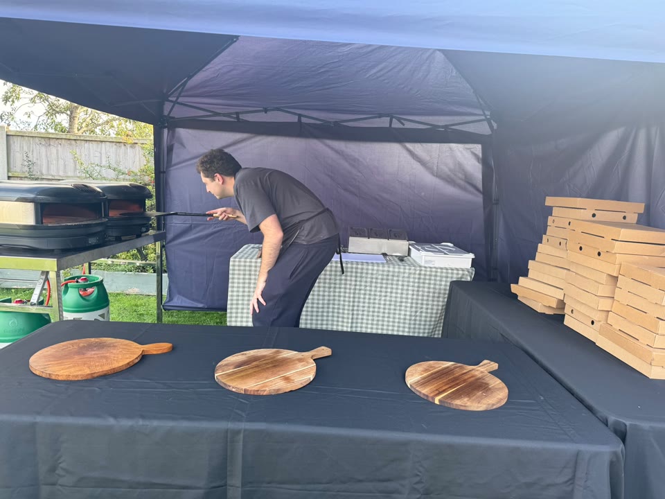 Xanders catering team preparing fresh pizza