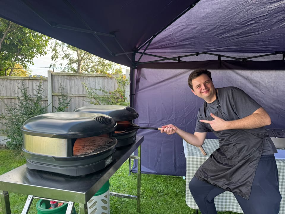 Xanders catering team preparing fresh pizza