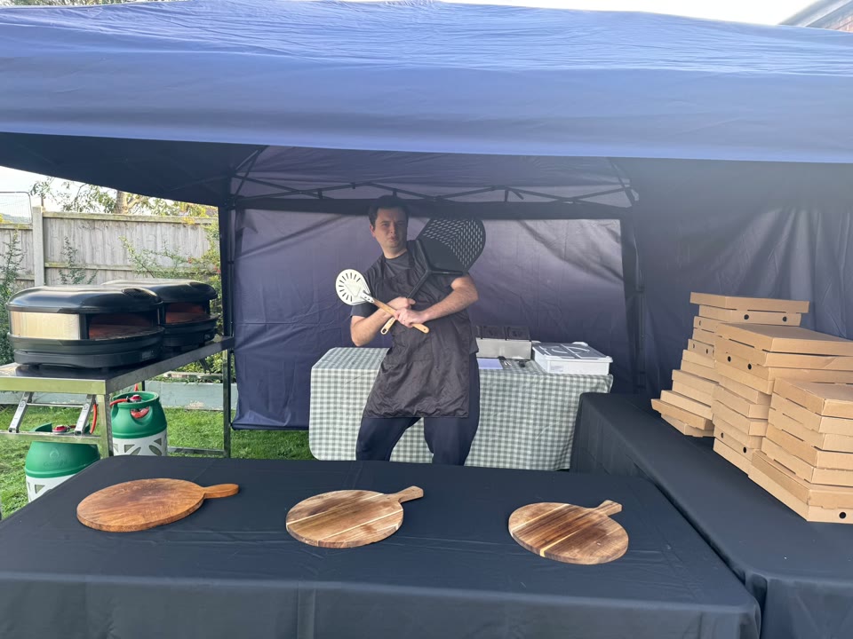 Xanders catering team preparing fresh pizza