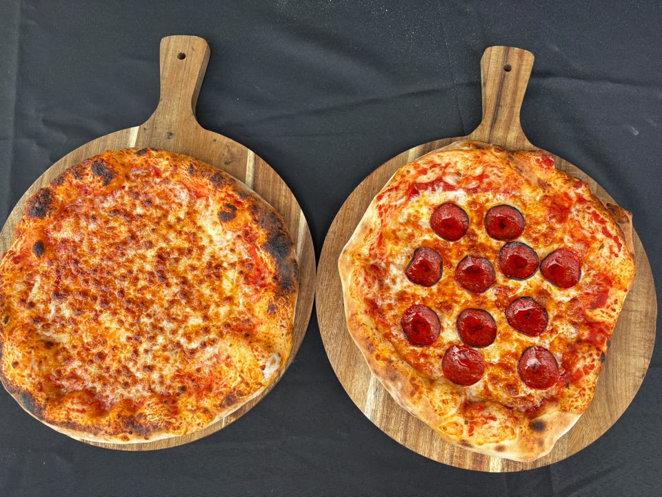 Xanders freshly cooked pizza on a serving board