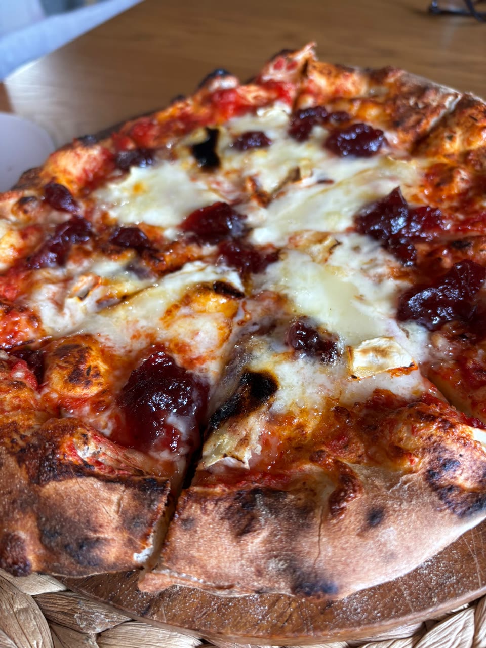 Xanders freshly cooked pizza on a serving board