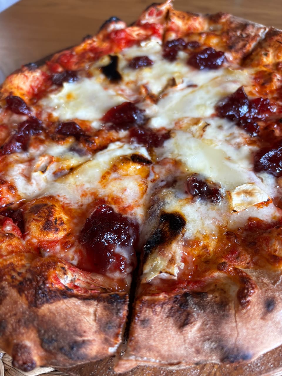 Xanders freshly cooked pizza on a serving board