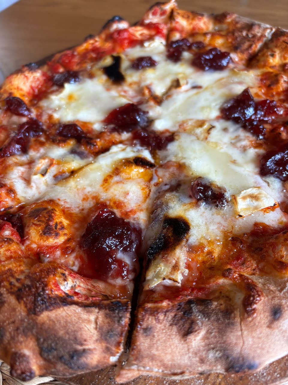 Xanders freshly cooked pizza on a serving board