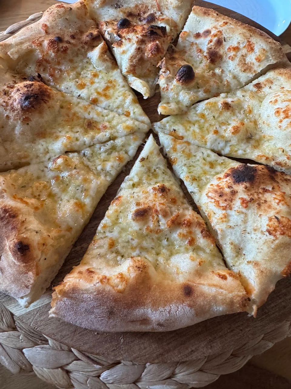 Xanders freshly cooked pizza on a serving board