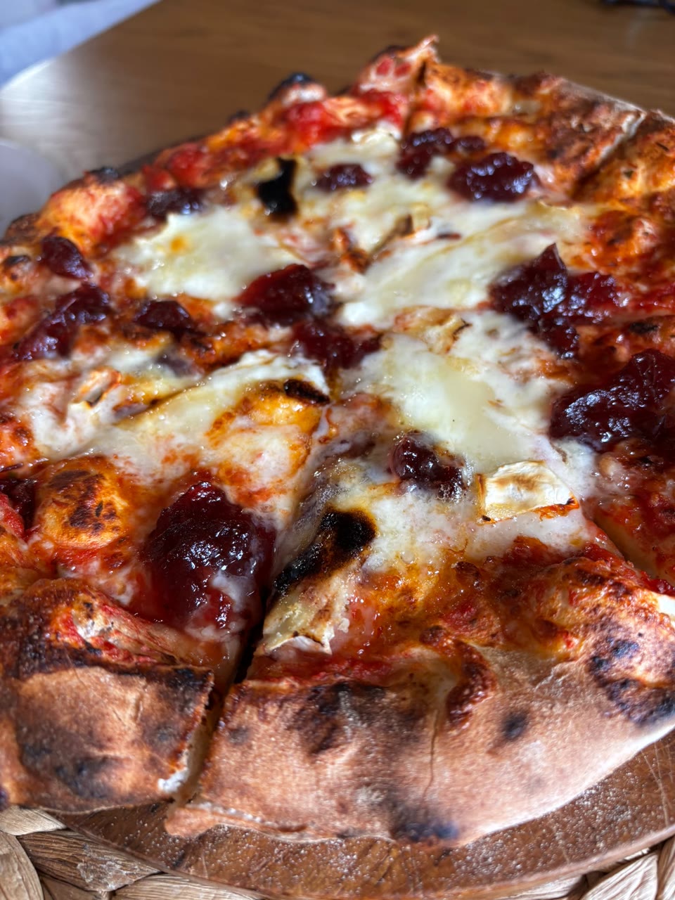 Xanders freshly cooked pizza on a serving board