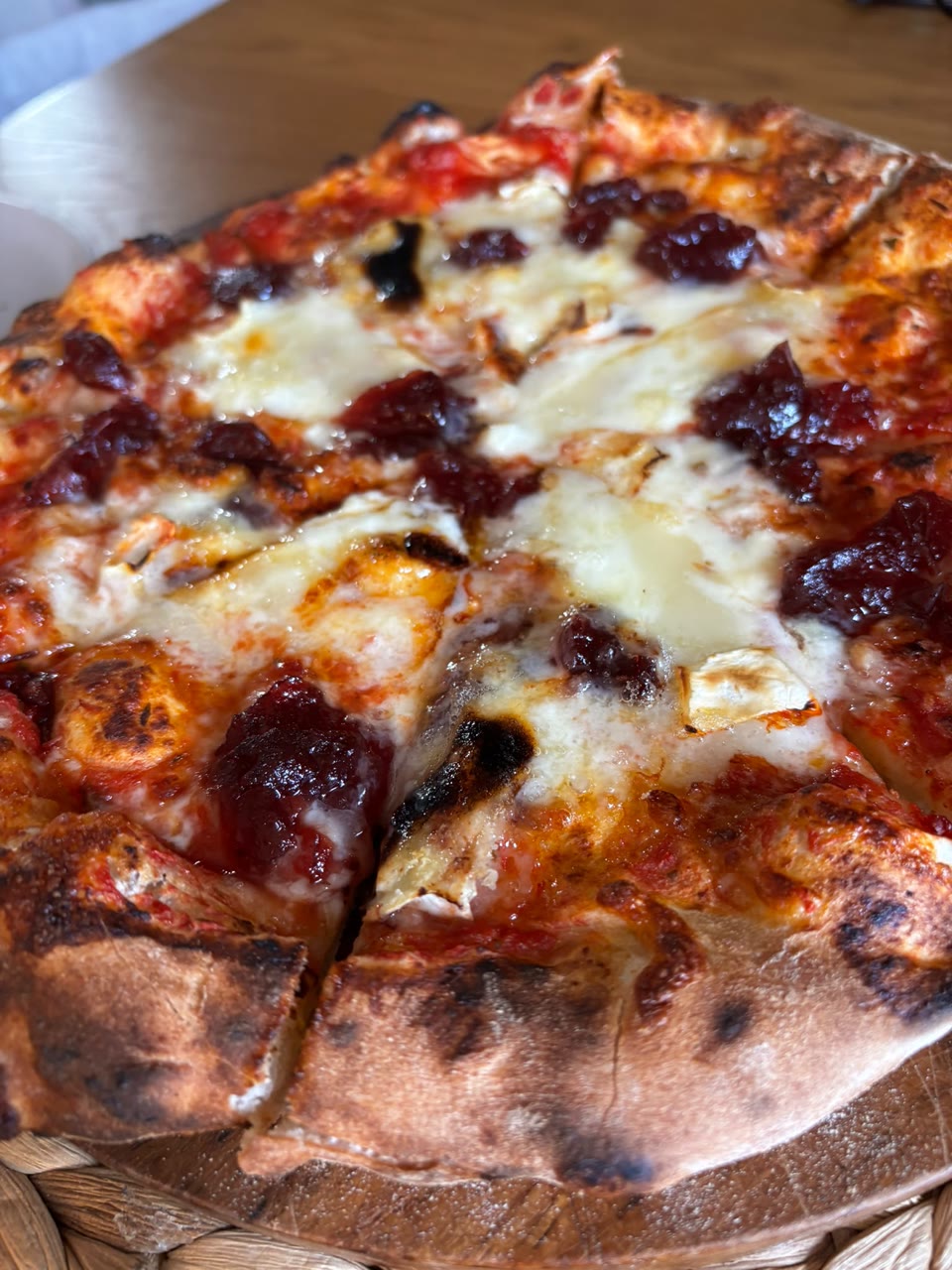 Xanders freshly cooked pizza on a serving board